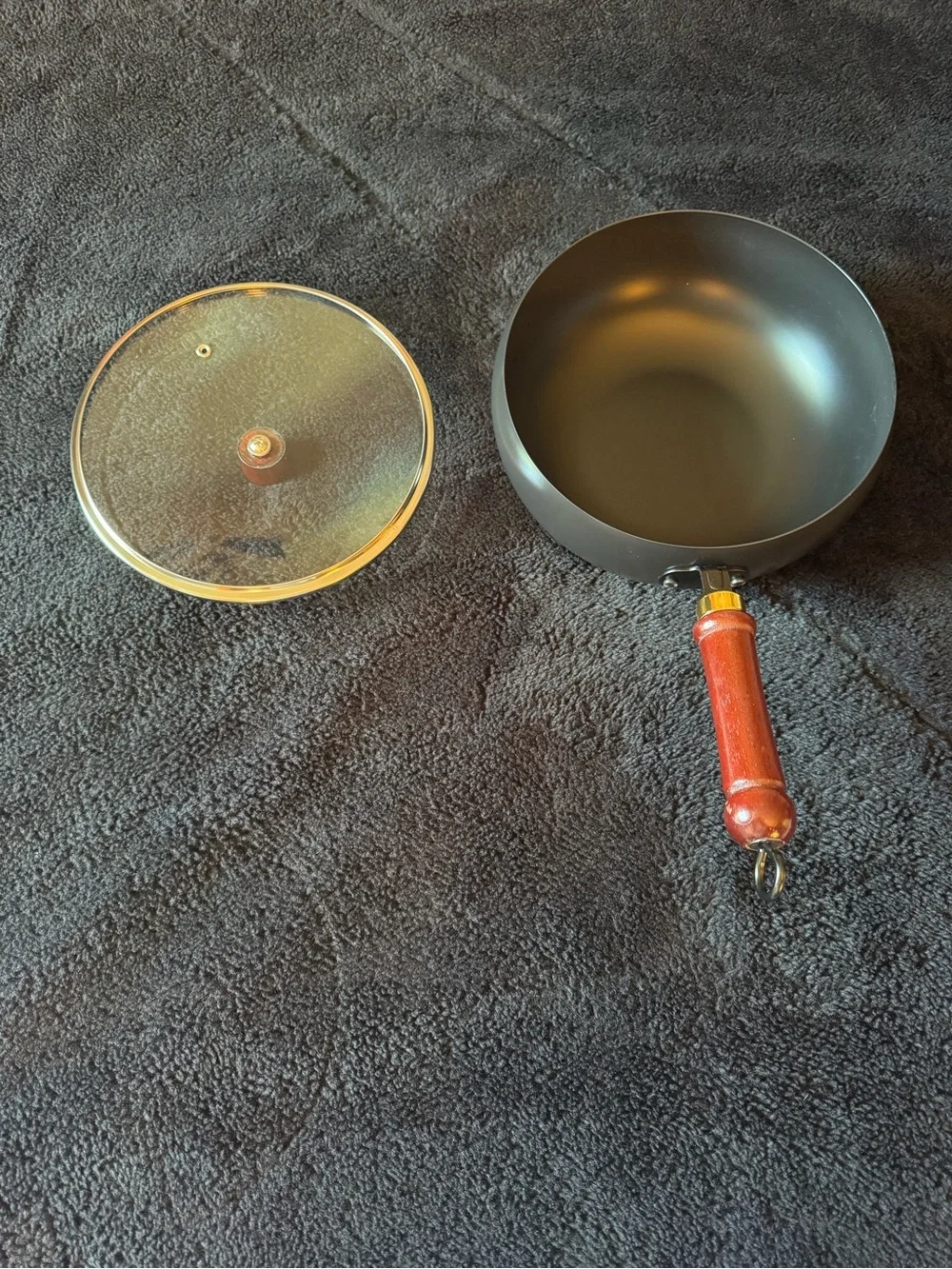 Bulbous Cast Iron Pot. Comes with 2 scrubs. Brand New in Box.